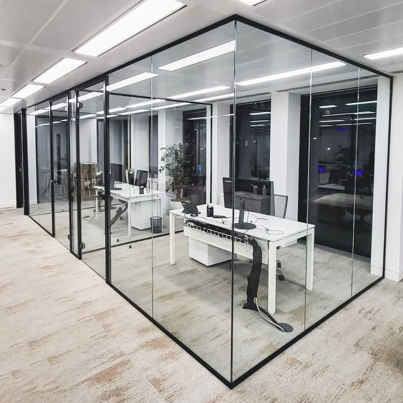 Black-framed glass office partition walls with a glass meeting room in Vancouver
