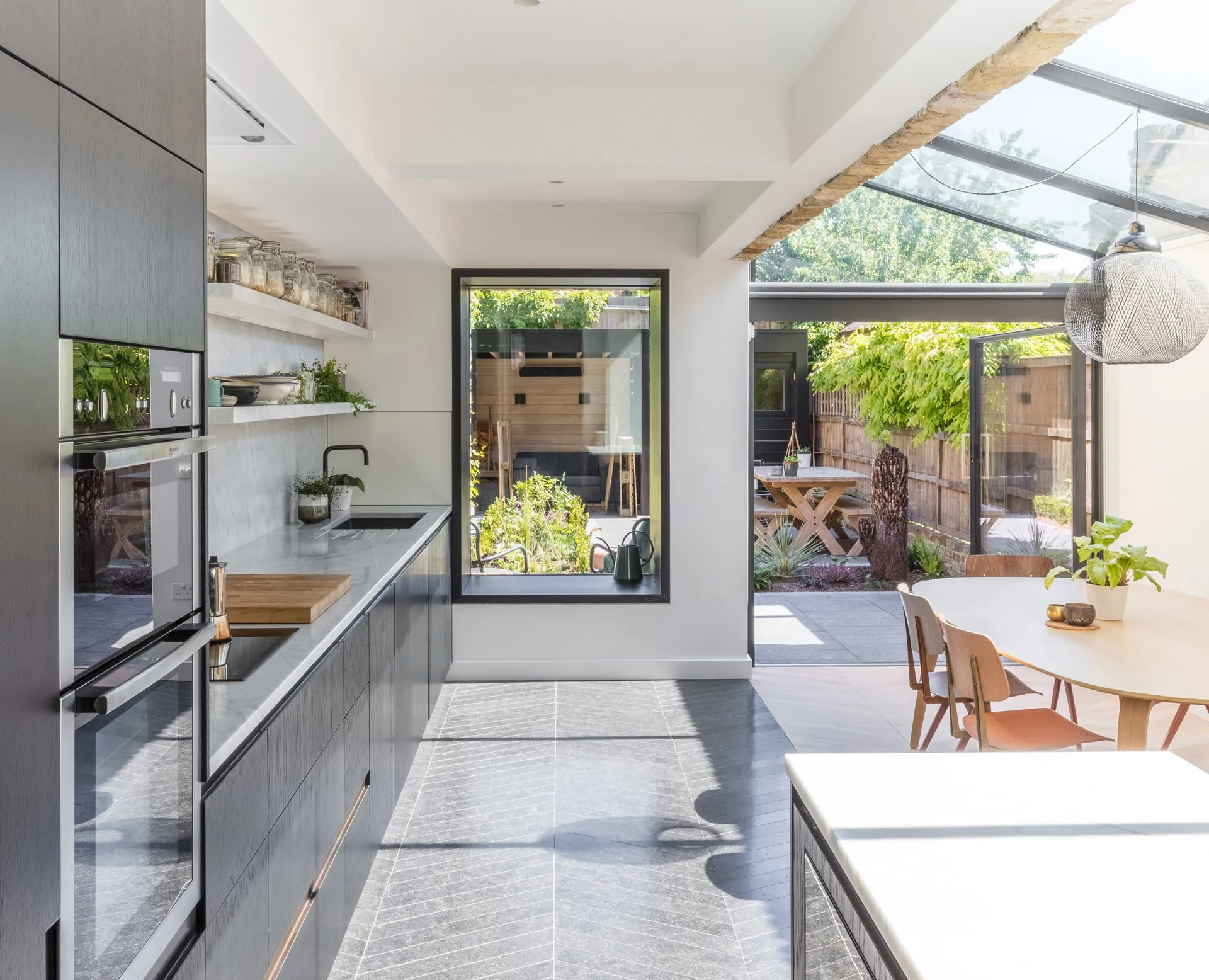 Kitchen glass extension with skylight and garden doors
