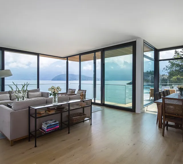 Floor-to-ceiling aluminum window wall with ocean view installed in a West Vancouver home