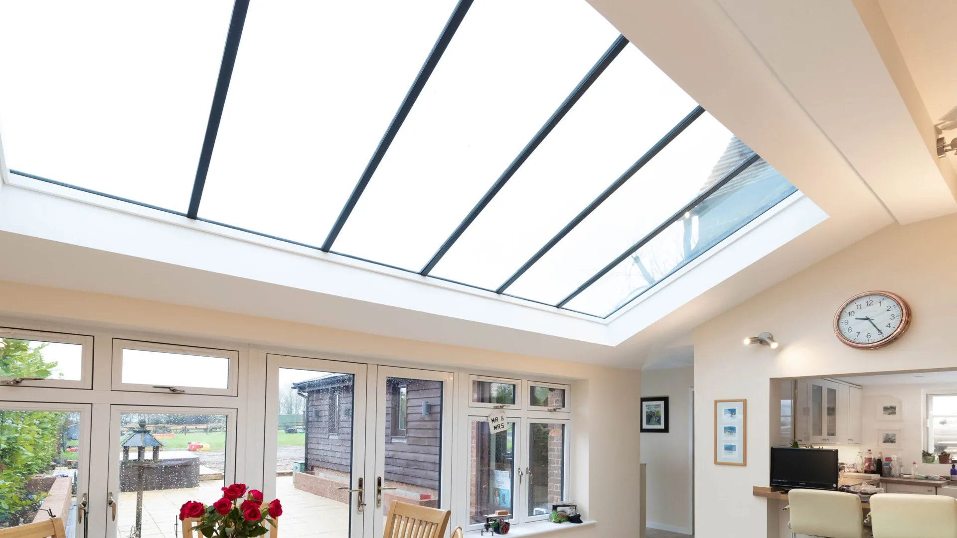 Custom glass skylight roof over a bright sunroom in Coquitlam BC
